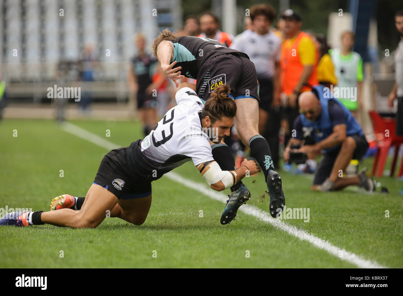 Parma, Italy. 30th September 2017. Zebre's wing Giovambattista Venditti tackles Ulster's captain Andrew Trimble in Guinness PRO14 rugby championship. Massimiliano Carnabuci/Alamy Live News Stock Photo
