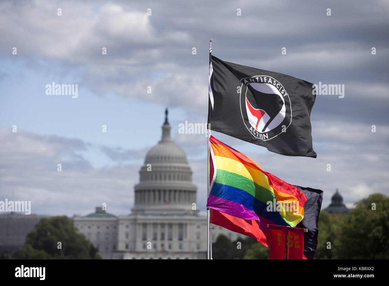 Washington, District of Columbia, USA. 30th Sep, 2017. Protesters hold a gay pride flag and an antifascist flag on the National Mall with the United States Capitol in the background during the March for Racial Justice in Washington, DC Credit: Alex Edelman/ZUMA Wire/Alamy Live News Stock Photo