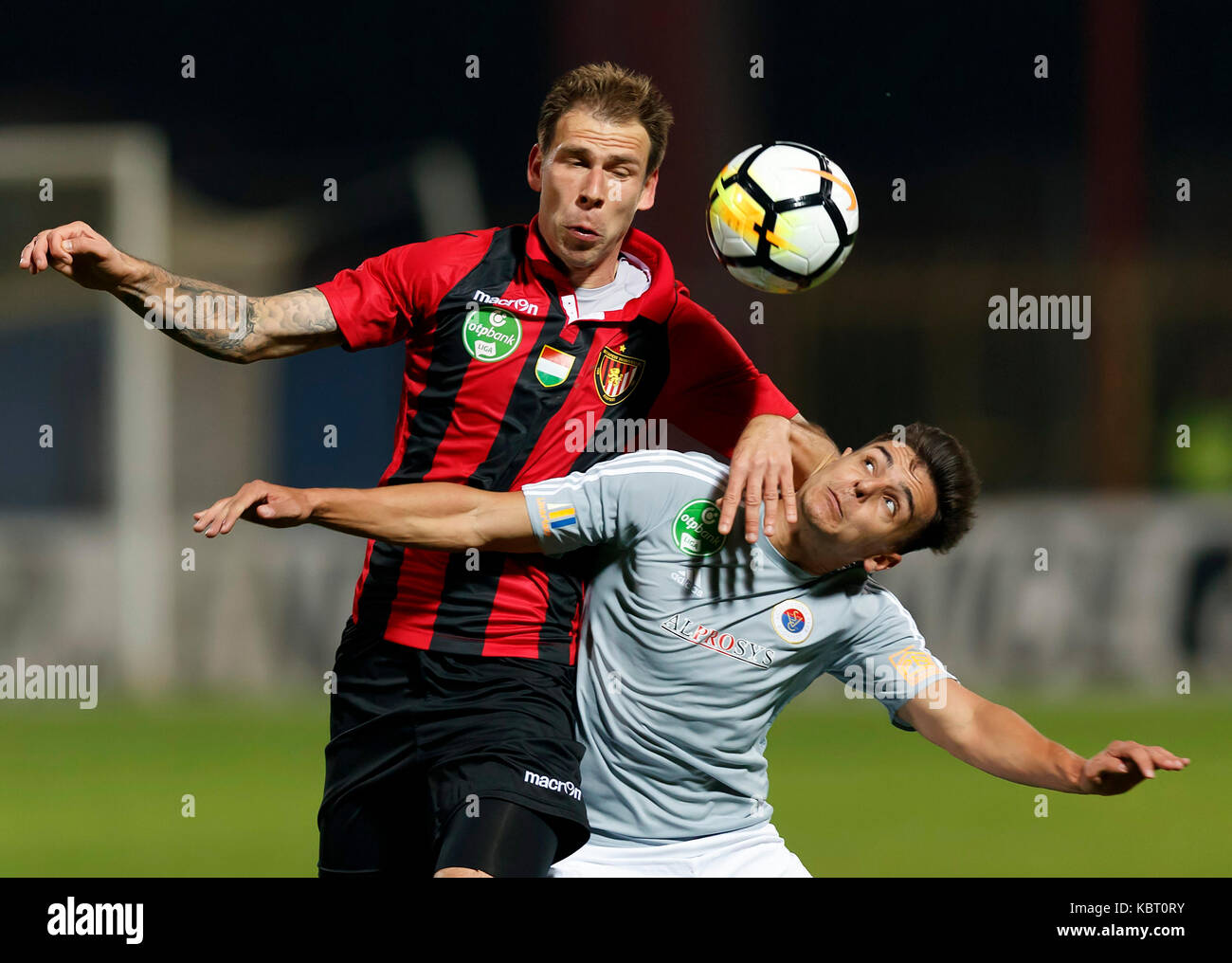 Ivan Petryak of MOL Fehervar FC dribbles between Franck Boli of