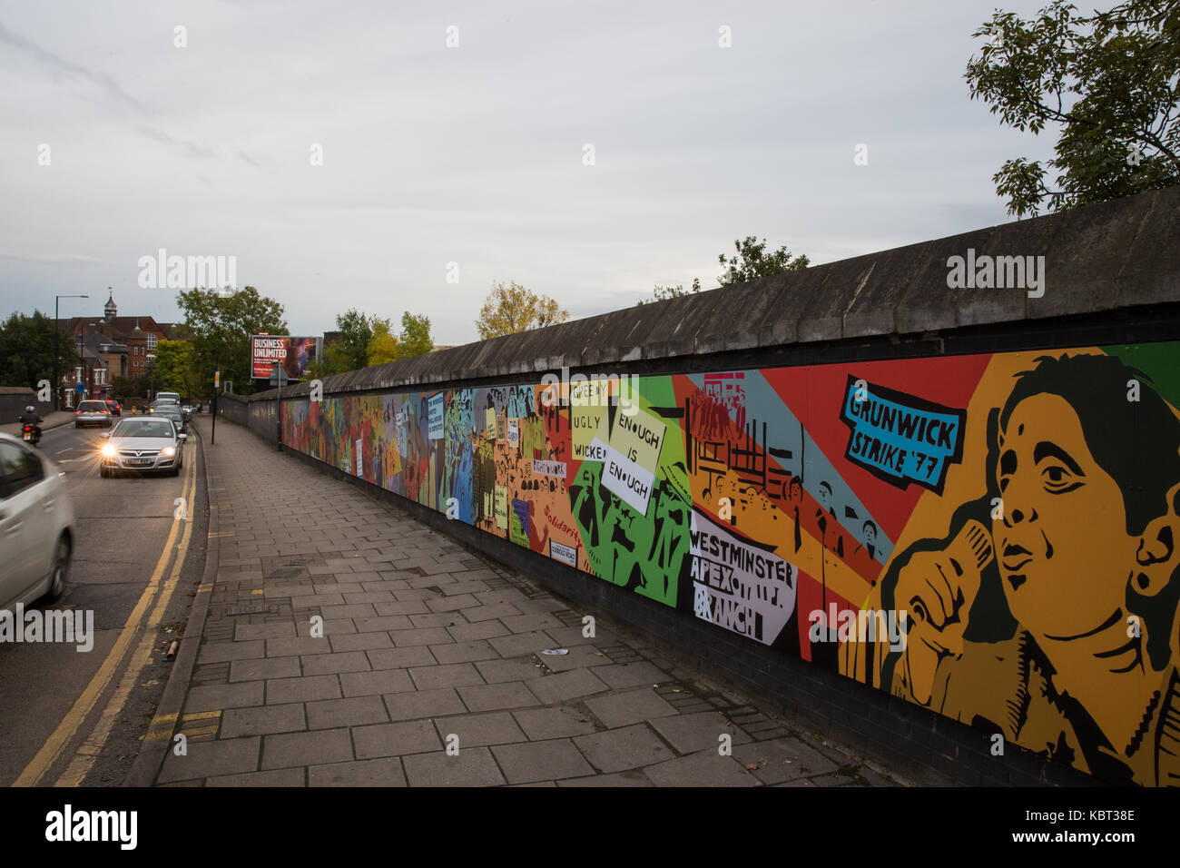 London, UK. 30th September, 2017. One of two colourful murals unveiled today in Dollis Hill to commemorate the 40th anniversary of the Grunwick strike. It was designed by artist Anna Ferrie in collaboration with more than 60 participants at community workshops to reflect both memories of the strike for those who were present and the hope it represents for younger generations. Credit: Mark Kerrison/Alamy Live News Stock Photo