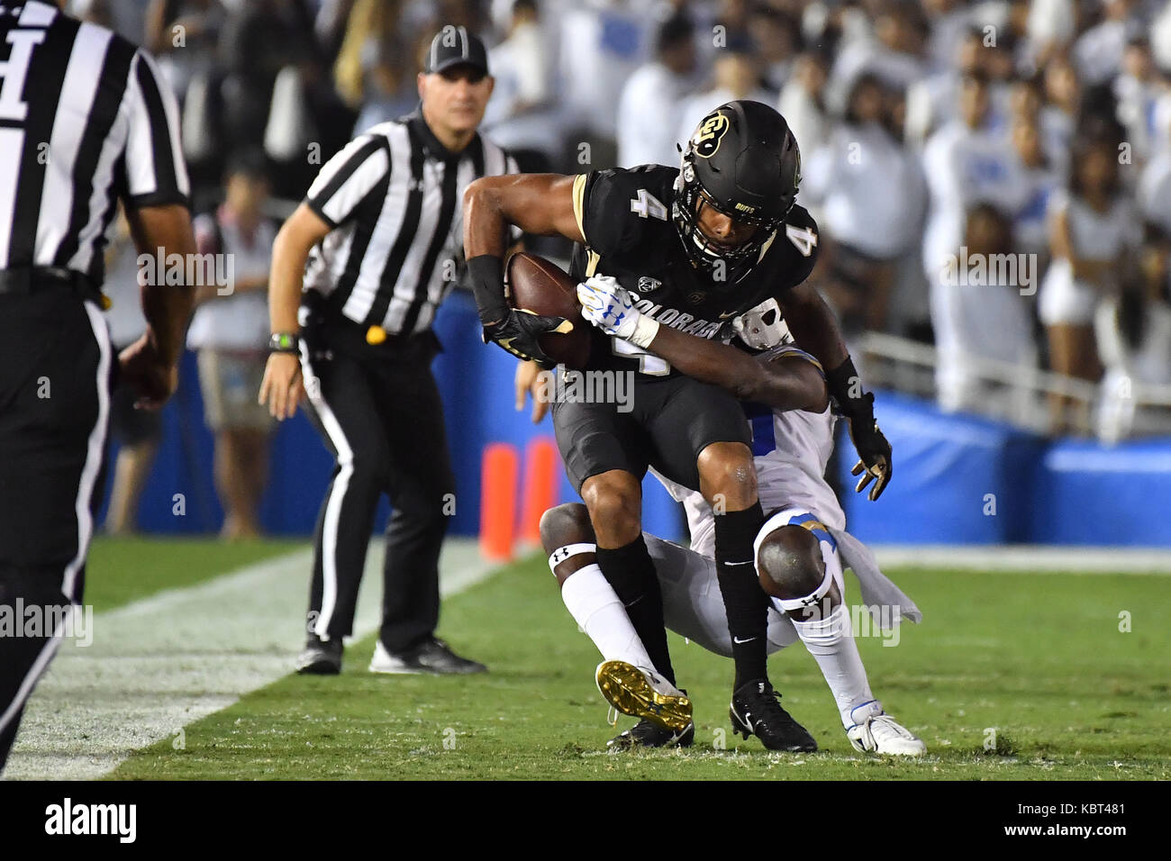 Colorado wide receiver Bryce Bobo, front top, is tackled by Arizona  defensive lineman Jeff Worthy, front bottom, as defensive backs Jamar  Allah, back left, and Tellas Jones defend during the second half