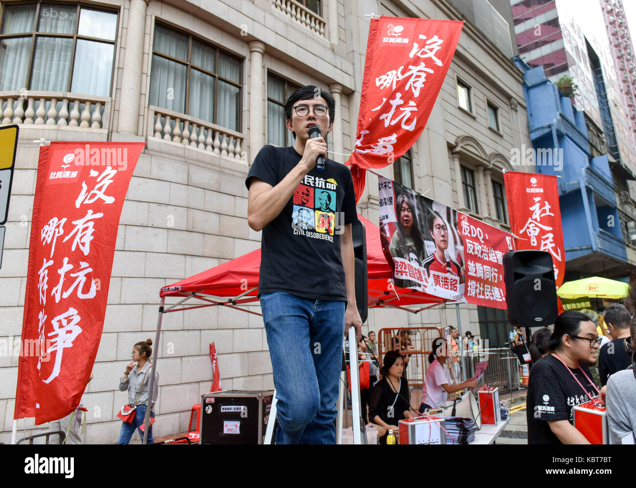 Hong Kong. 1st October, 2017. Activist and politican, Avery Ng Man-yuen, encourages the crowd as they pass.Hong Kong's 68th National Day is marked by a mass rally. Various political parties called for the rally in light of recent suppression of those speaking out against what they see as the disintegration of the Basic Law and the "one country, two systems"" .Dubbed as the "Anti-authoritarian rally-No more political Suppression. Credit: ZUMA Press, Inc./Alamy Live News Stock Photo