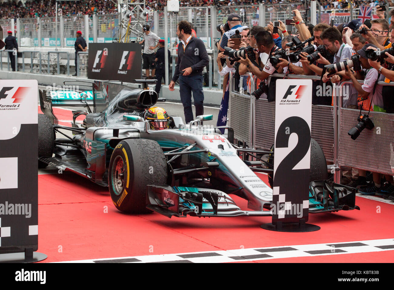 Lewis Hamilton from Mercedes parks in front of the podium at the end the F1 Grand Prix at the Sepang F1 circuit. Hamilton finished the race in second. On October 01, 2017 in Kuala Lumpur, Malaysia. Stock Photo