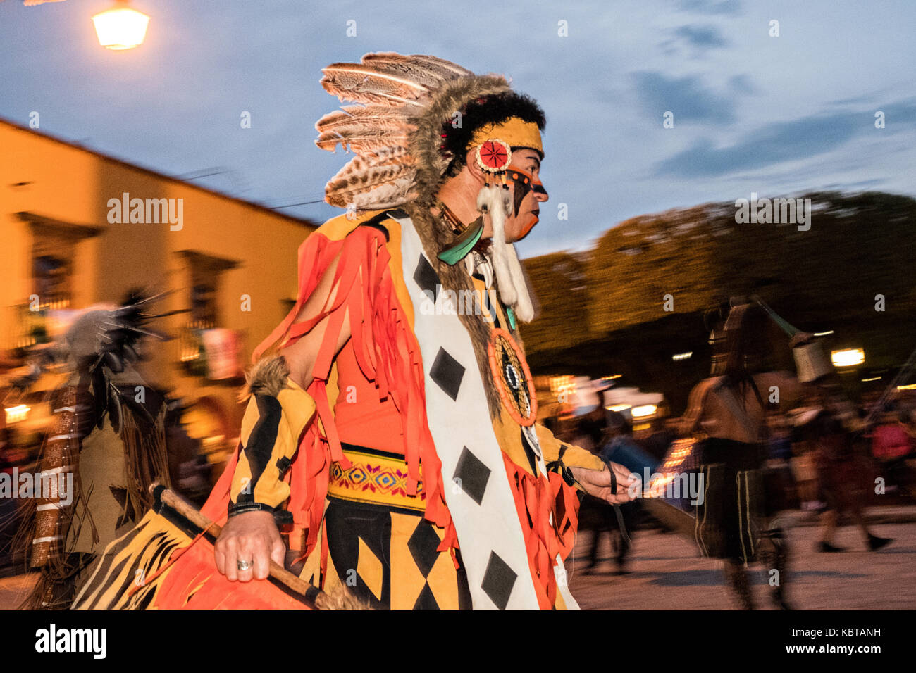 A man dressed in Native American costume performs the Concheros dance  during the week long fiesta of the patron saint Saint Michael September 26,  2017 in San Miguel de Allende, Mexico Stock