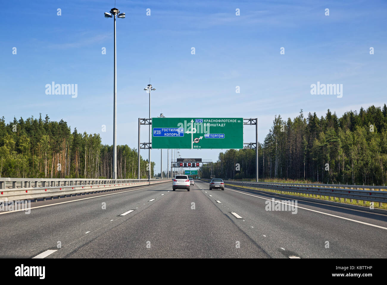 Ring road of St. Petersburg. The signs before the interchange at Peterhof, Leningrad region. On the green scoreboard shows the names of suburbs of St. Stock Photo