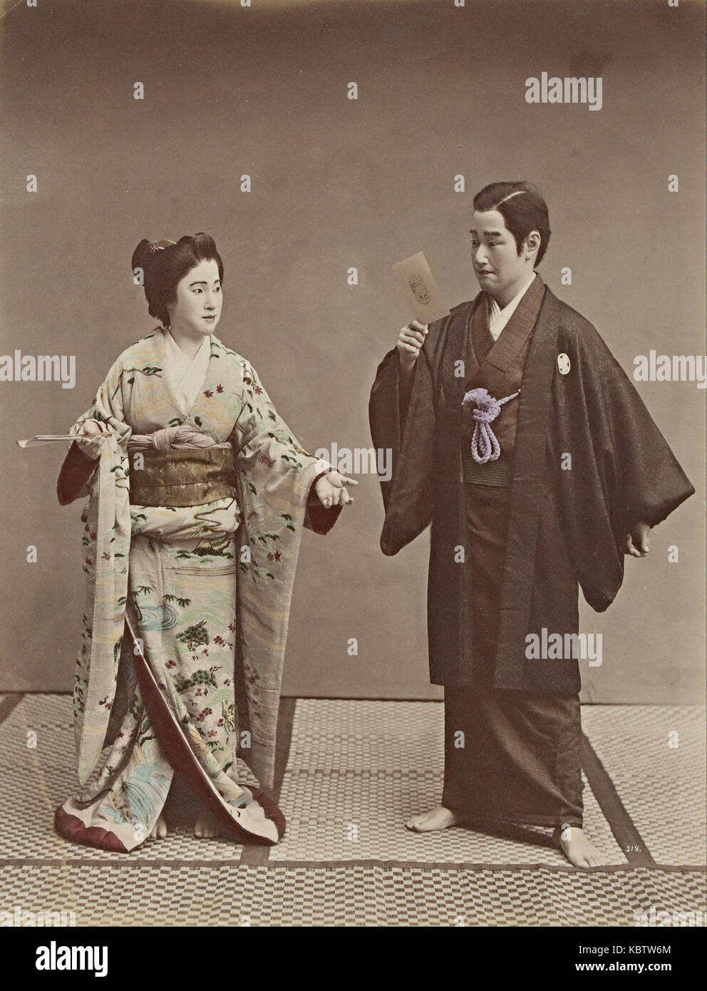 Kusakabe Kimbei   No title (Couple with a cabinet photograph and ghost in background) Stock Photo