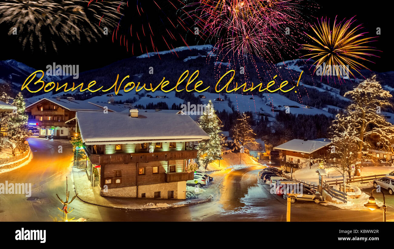 New Year S Eve Card With Alpine Village In Snow Fireworks French Text Bonne Nouvelle Annee Stock Photo Alamy