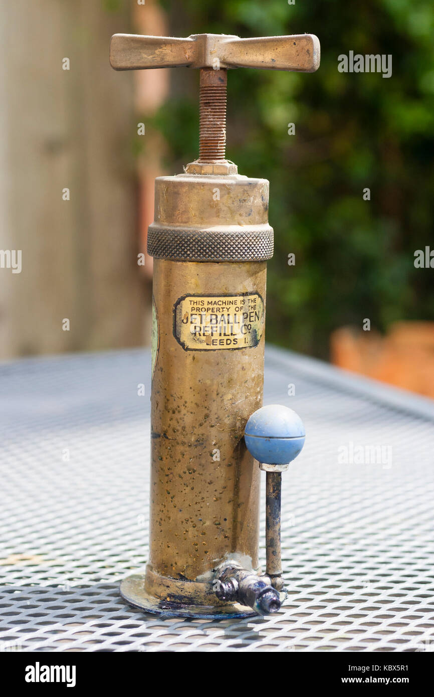Antique brass ink dispenser used for refilling ball pens and manufactured by the Jet Ball Pen Refill Co Stock Photo