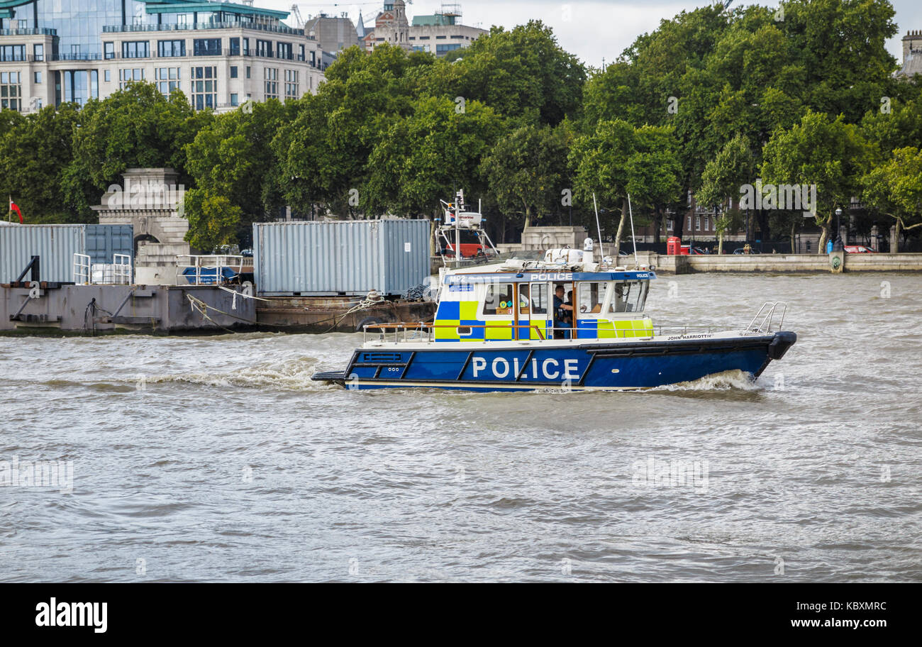 Law enforcement: Metropolitan river police launch sailing on patrol on the River Thames by Victoria Embankment, Westminster, London, UK Stock Photo