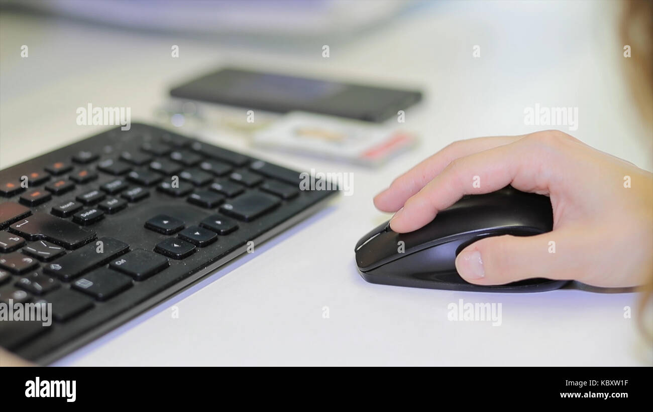 Closeup of woman hand clicking mouse outdoor. Closeup of female fingers