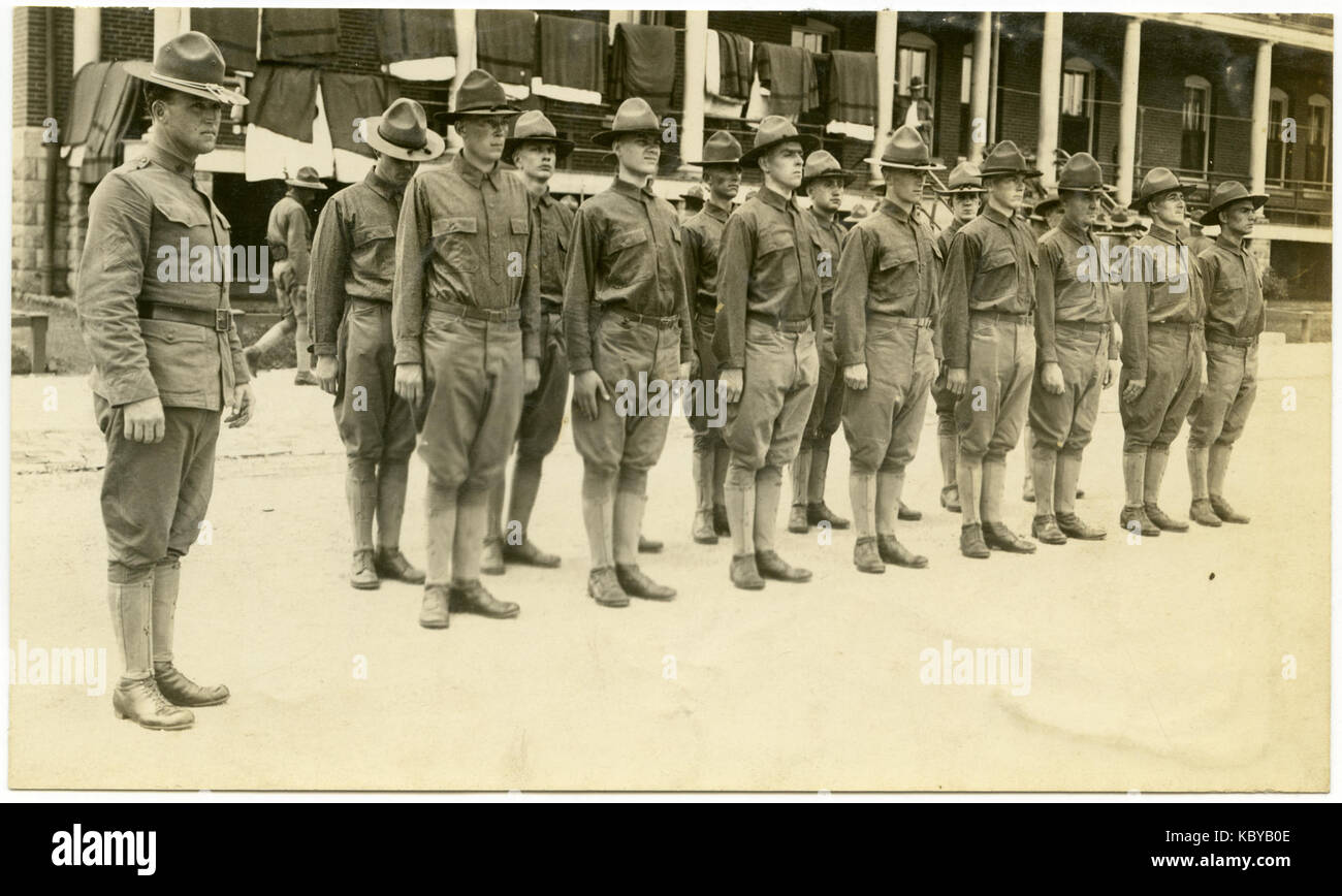 A Group of Soldiers Lined Up in Two Rows Standing at Attention Stock