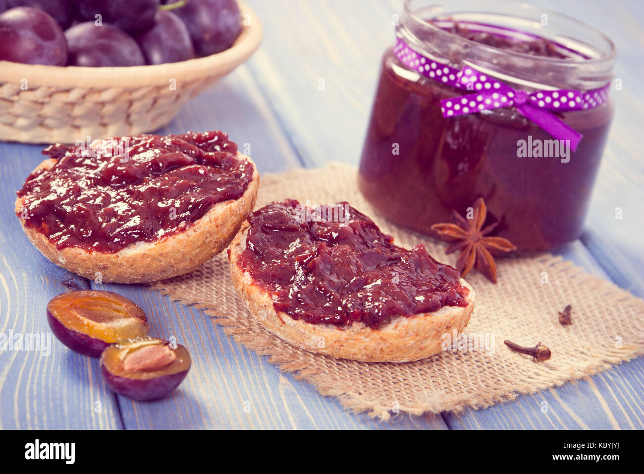 Vintage photo, Sandwiches with homemade plum marmalade or jam, concept of healthy sweet snack, breakfast or dessert Stock Photo