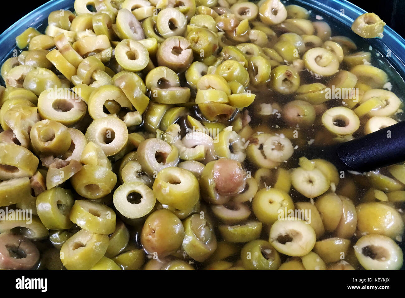 Green olives in olive oil Stock Photo Alamy