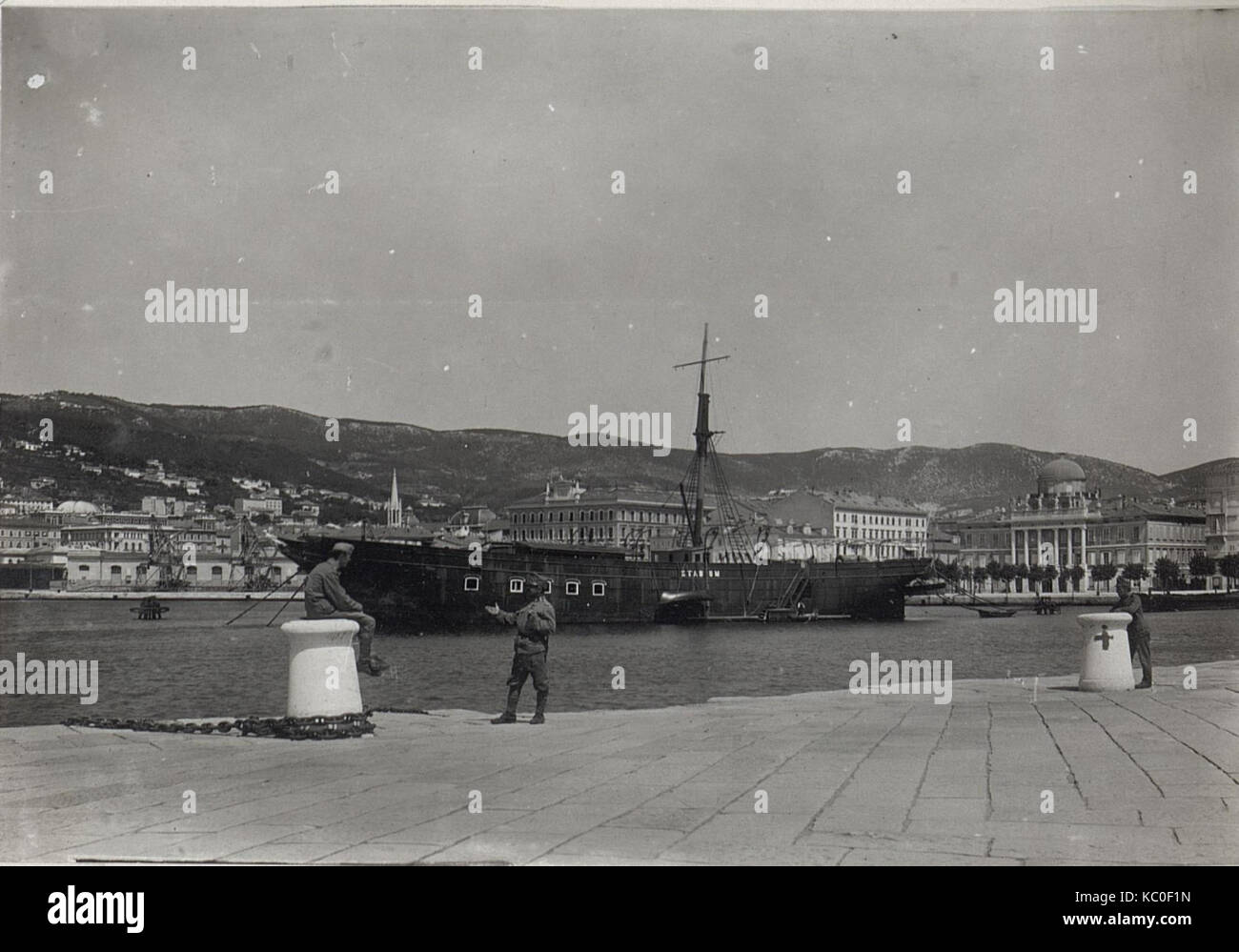 Blick vom Molo S. Carlo auf Governo Marito is a photograph depicting a view of the Government Palace from the pier in Trieste, Italy. The image captures the architectural features of the palace and surrounding scenery, offering a glimpse into the city's urban landscape. Stock Photo