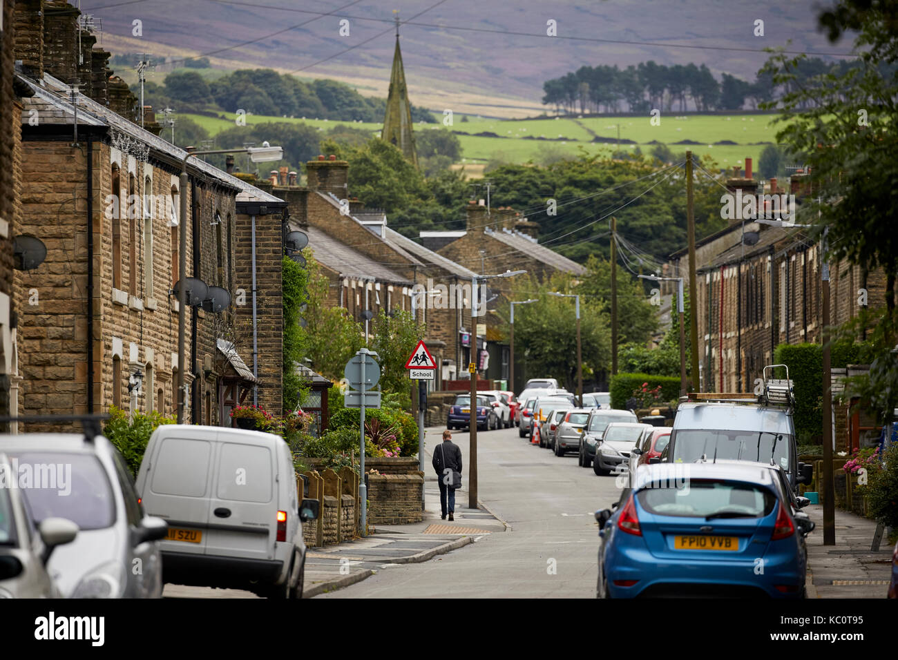 Pikes lane typical stone terraced housing stock view along a residential street in Glossop, Derbyshire. Stock Photo