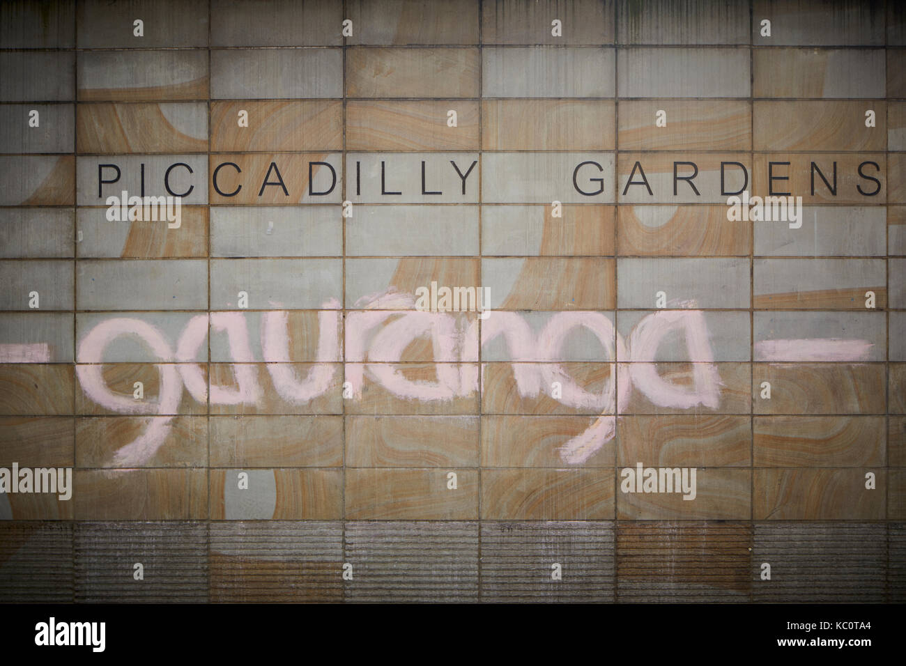 Manchester Piccadilly gardens wall with graffiti saying gauranga, term popularised by the Hare Krishna movement, Call out Gouranga and be happy Stock Photo