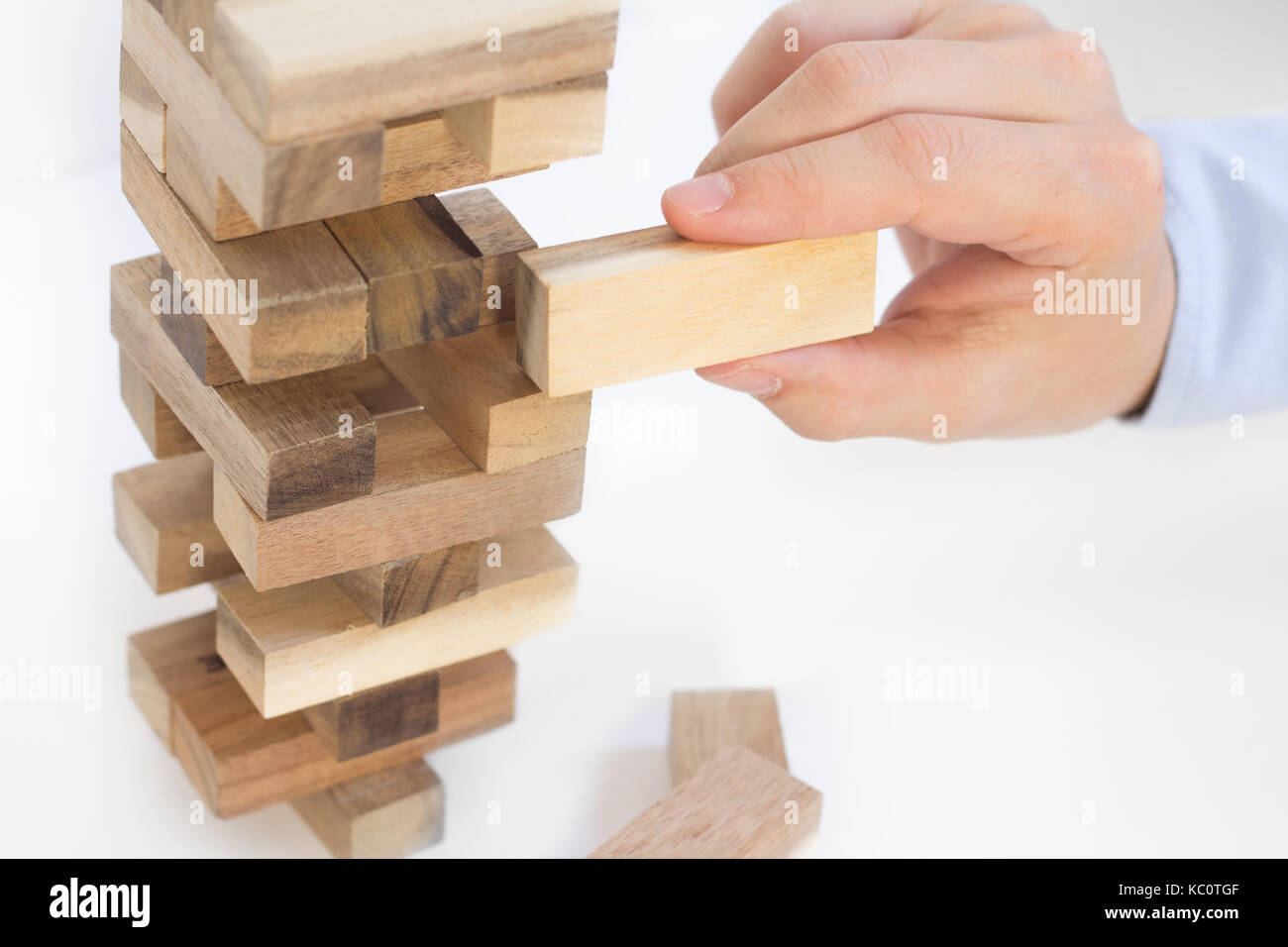 hand building wood block tower Stock Photo