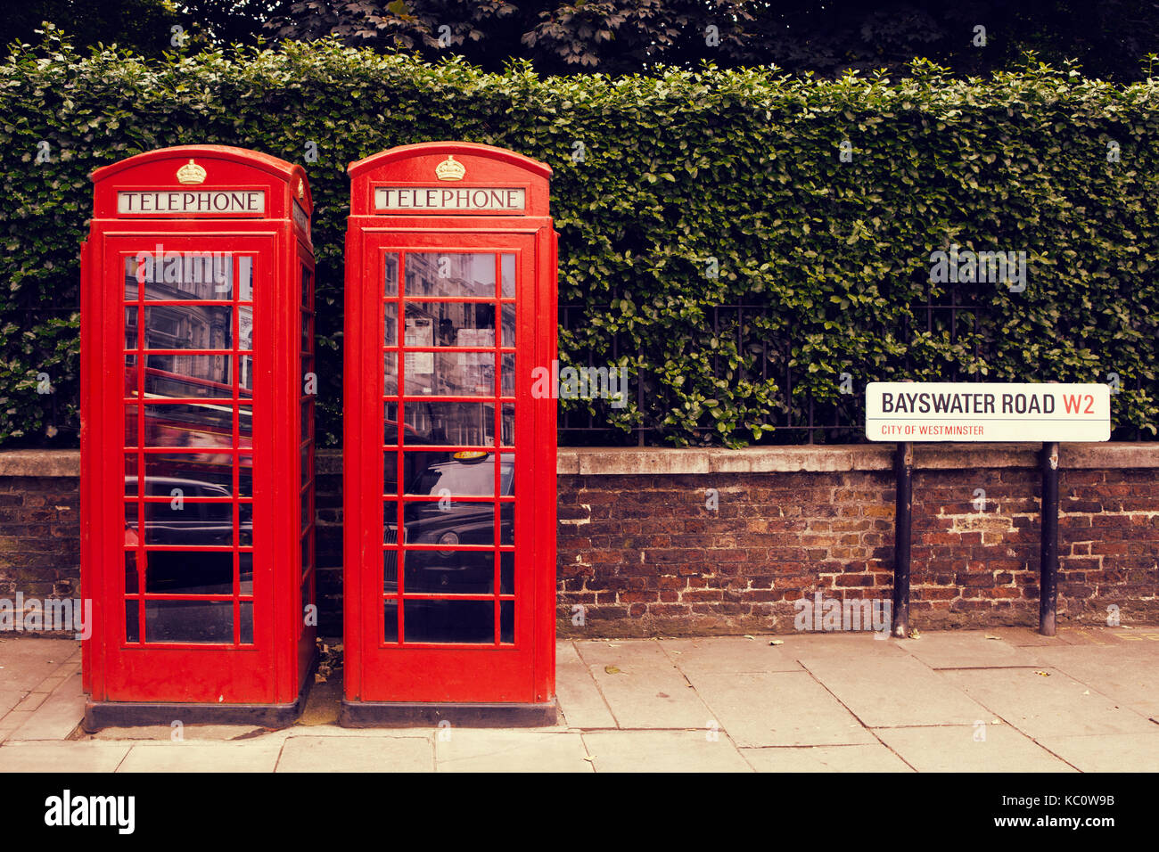 art row of traditional phone boxes in London city Stock Photo