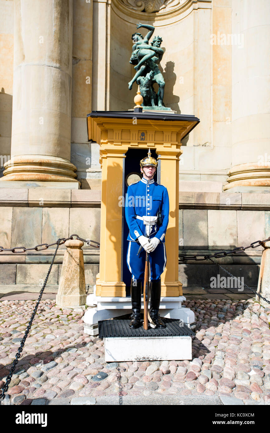 A Swedish Royal Guard standing guard outside the Royal Palace in Stockholm, Sweden Stock Photo