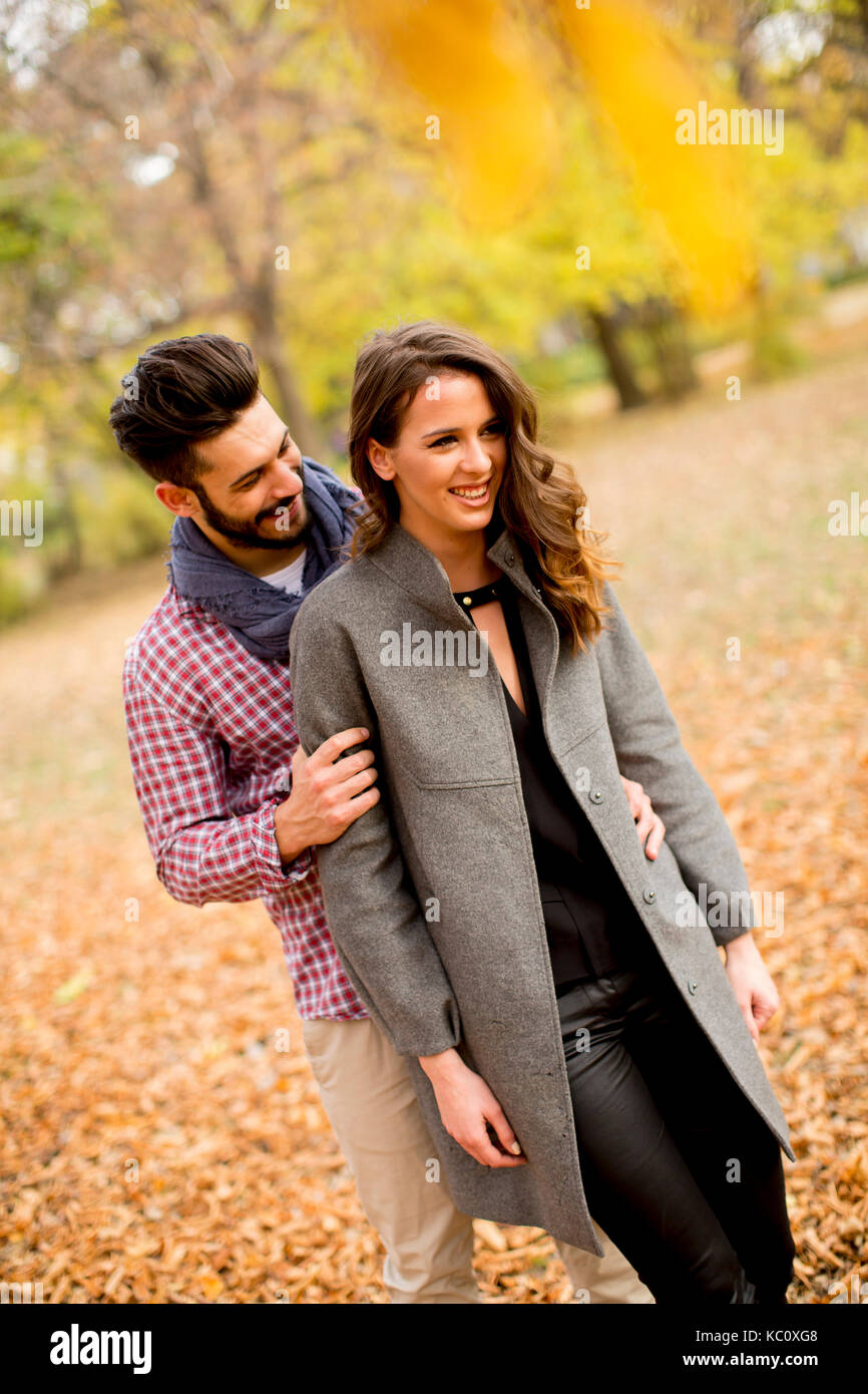 Young couple in love in the autumn forest Stock Photo - Alamy