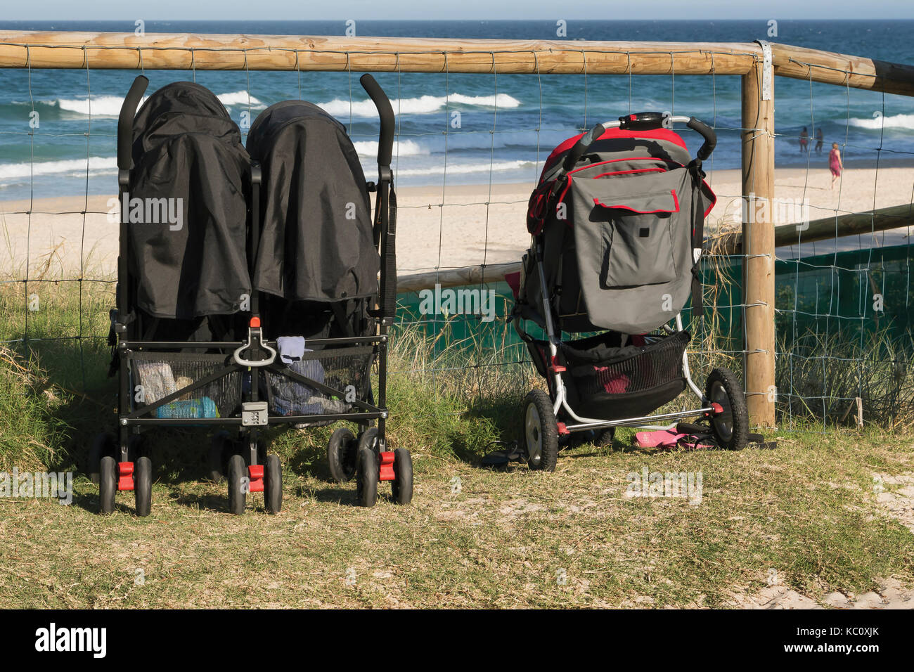 Strollers by the beach Stock Photo Alamy