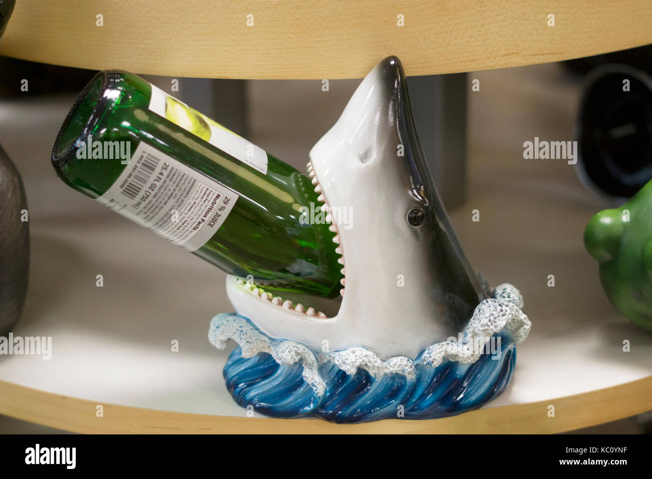 A shark wine bottle holder for sale at Gizmos & Gadgets at the Tanger Outlet Mall in Deer Park, Long Island, New York. Stock Photo