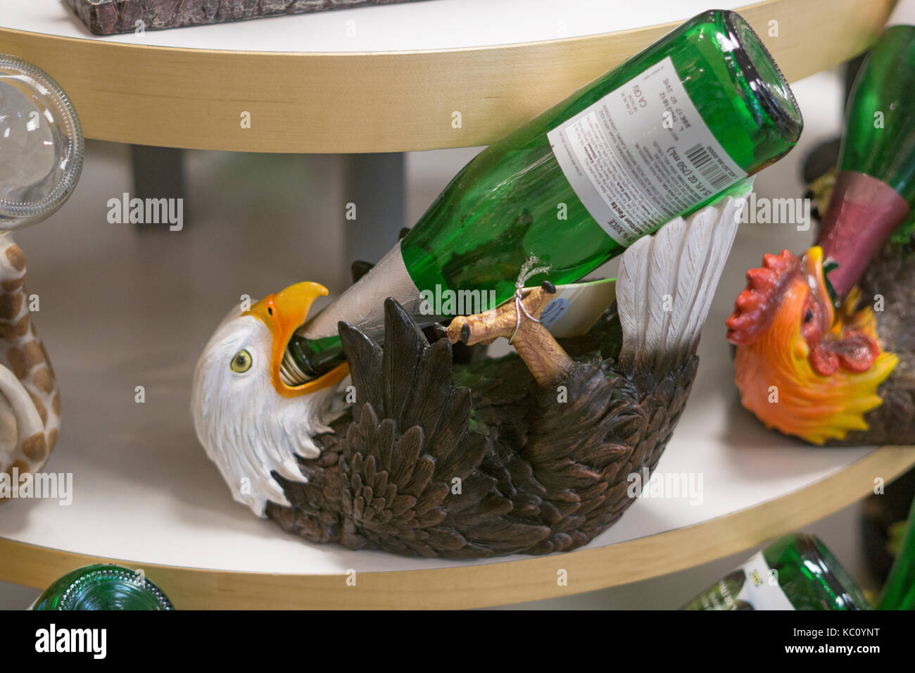 An eagle shaped wine bottle holder for sale at Gizmos & Gadgets at the Tanger Outlet Mall in Deer Park, Long Island, New York. Stock Photo
