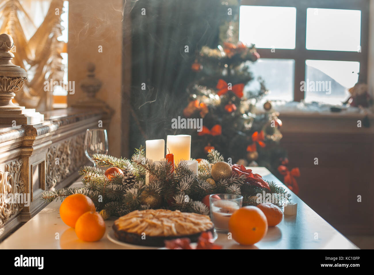 Festive Christmas table with decorations and cake in the living room