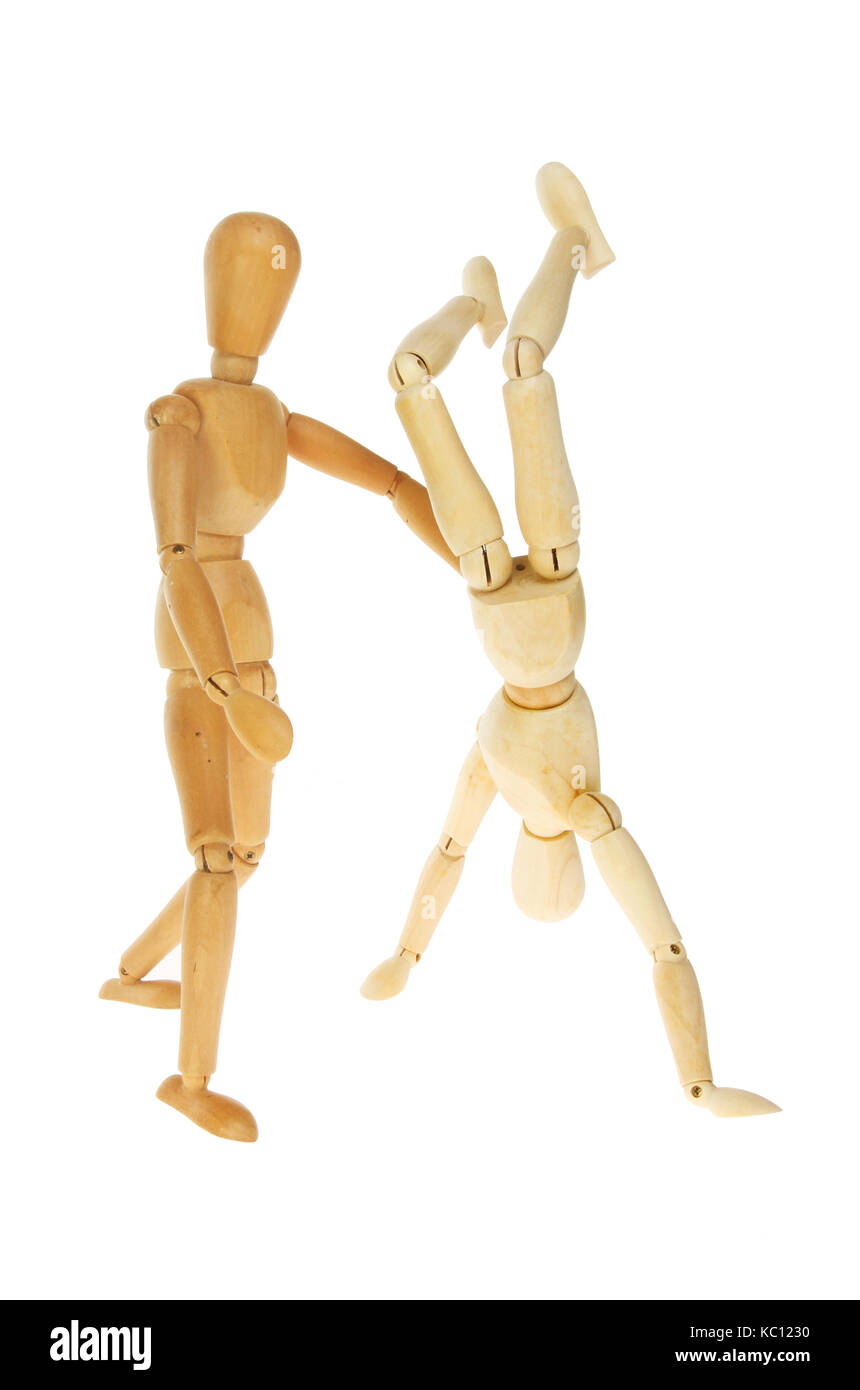 Two artists's manikins doing gymnastics isolated against white Stock Photo