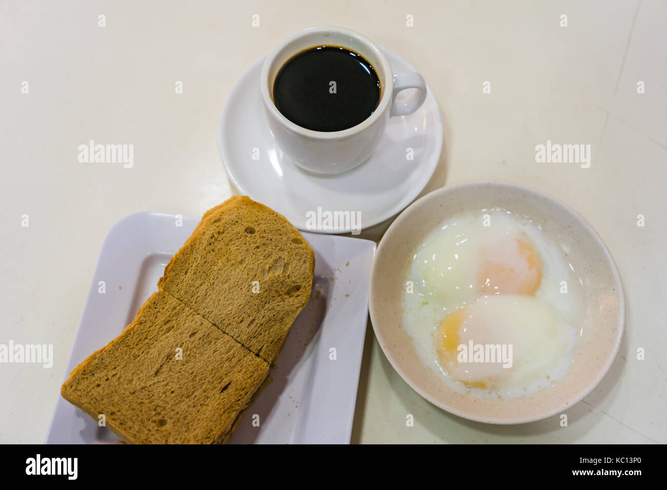 Singapore Breakfast called Kaya Toast, Coffee bread and Halfboiled