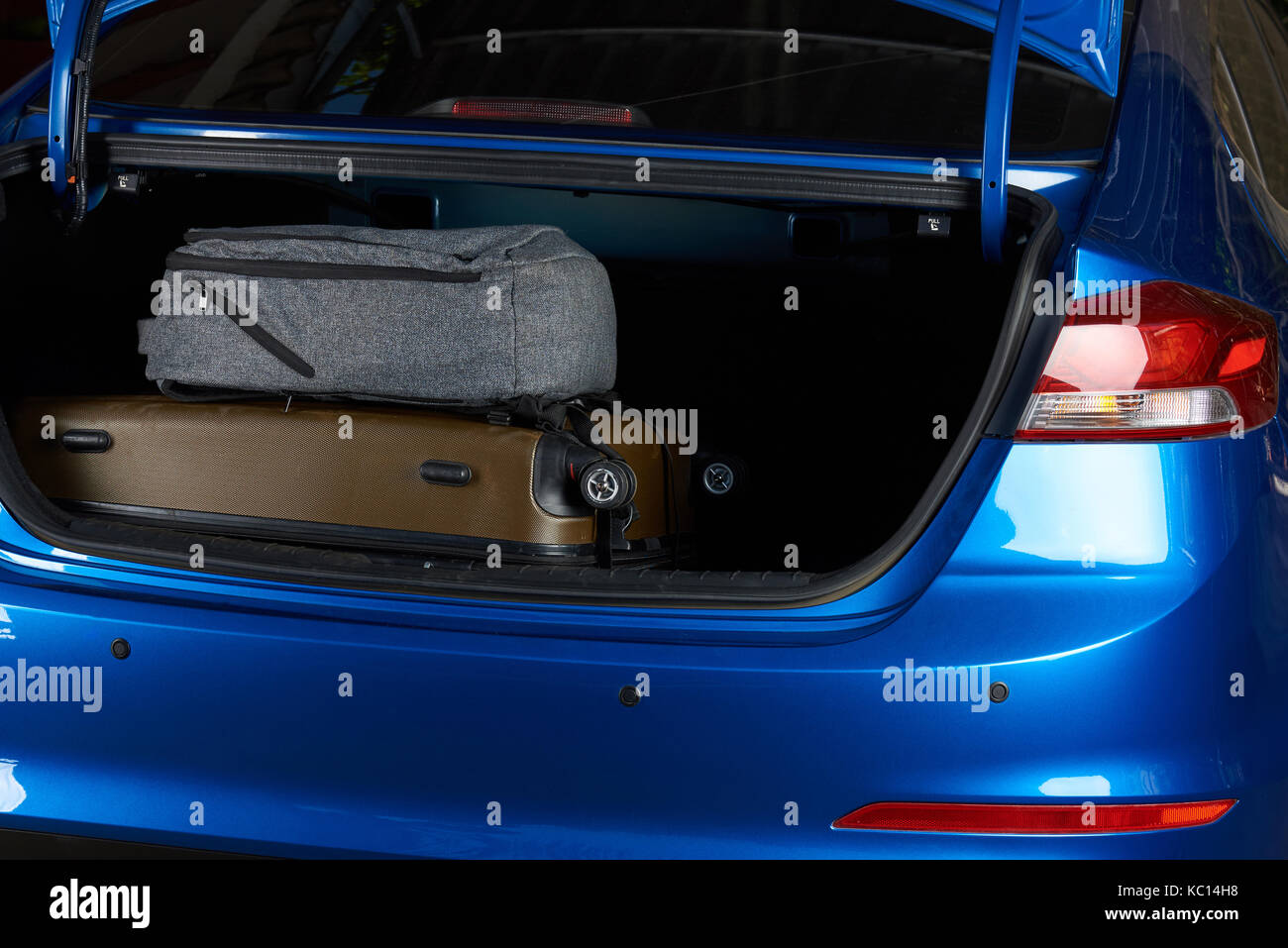 Close-up of car trunk with bags. Modern sedan car trunk Stock Photo