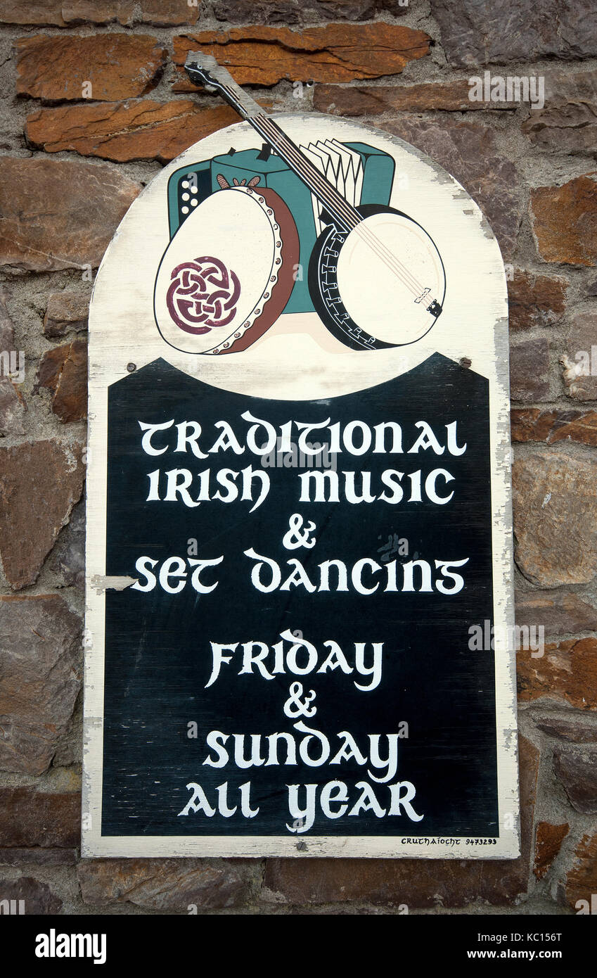 Wooden sign about irish traditional music and dance at The Bridge Bar and The Moorings Restaurant, Portmagee, County Kerry, Ireland Stock Photo