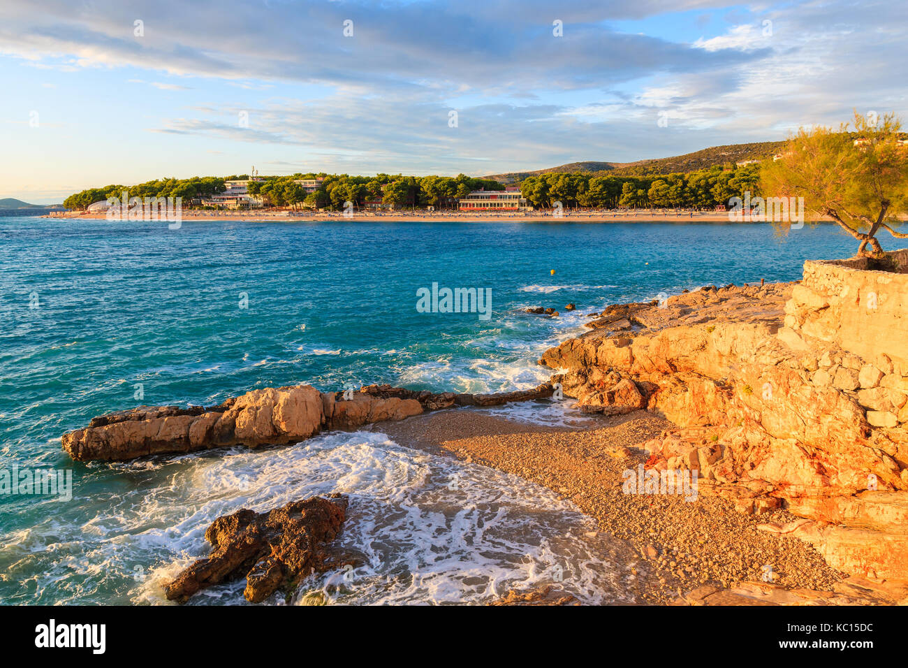 Sea waves on small beach at sunset time in Primosten town, Dalmatia, Croatia Stock Photo