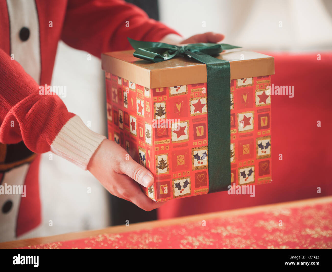 girl holding a Christmas gift box Stock Photo - Alamy