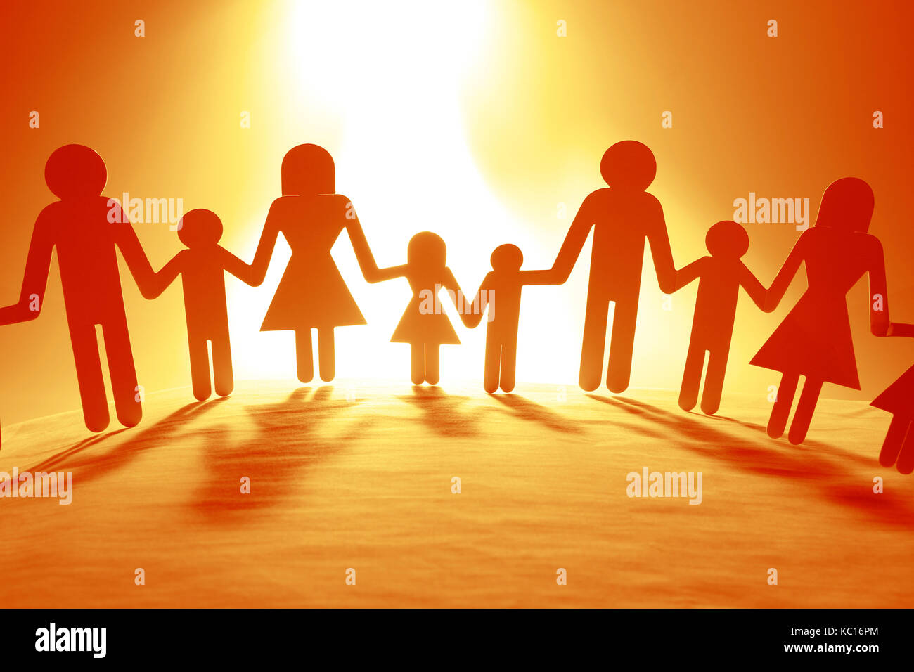 Family paper chain cutout holding hands Stock Photo - Alamy