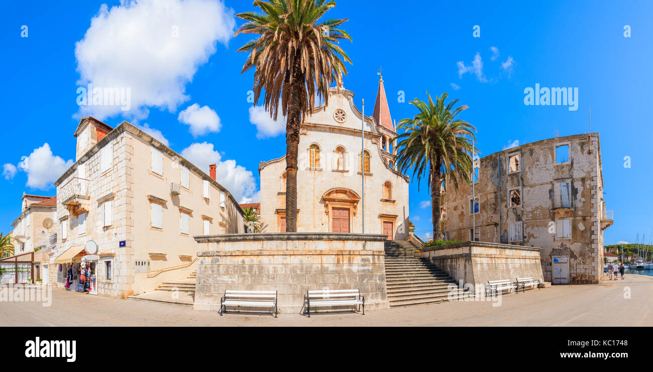 Panoramic front view of church in Milna town in afternoon sunlight, Brac island, Croatia Stock Photo