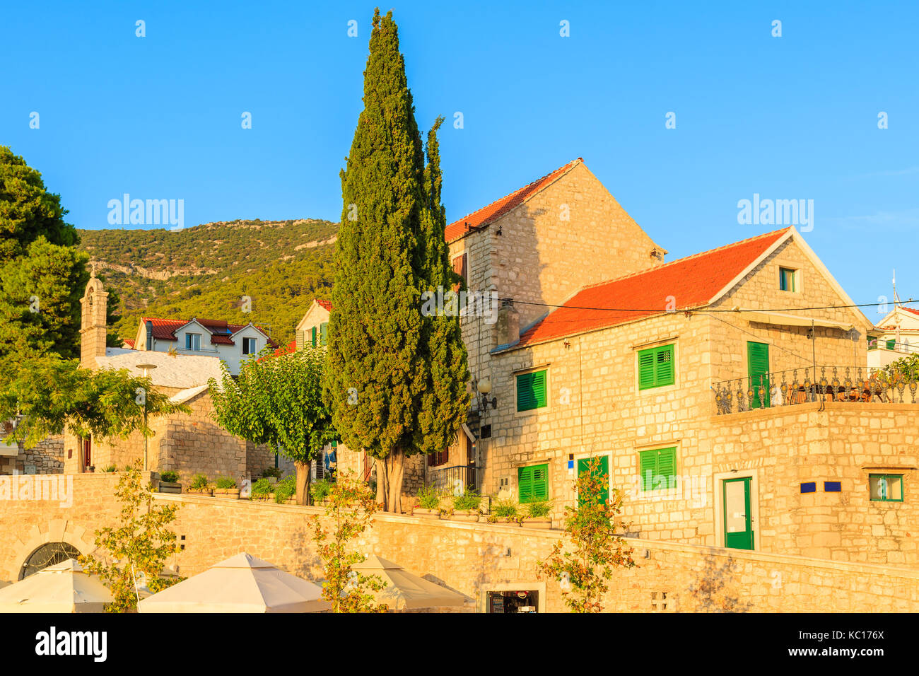 Typical old houses in Bol port at sunset time, Brac island, Croatia Stock Photo