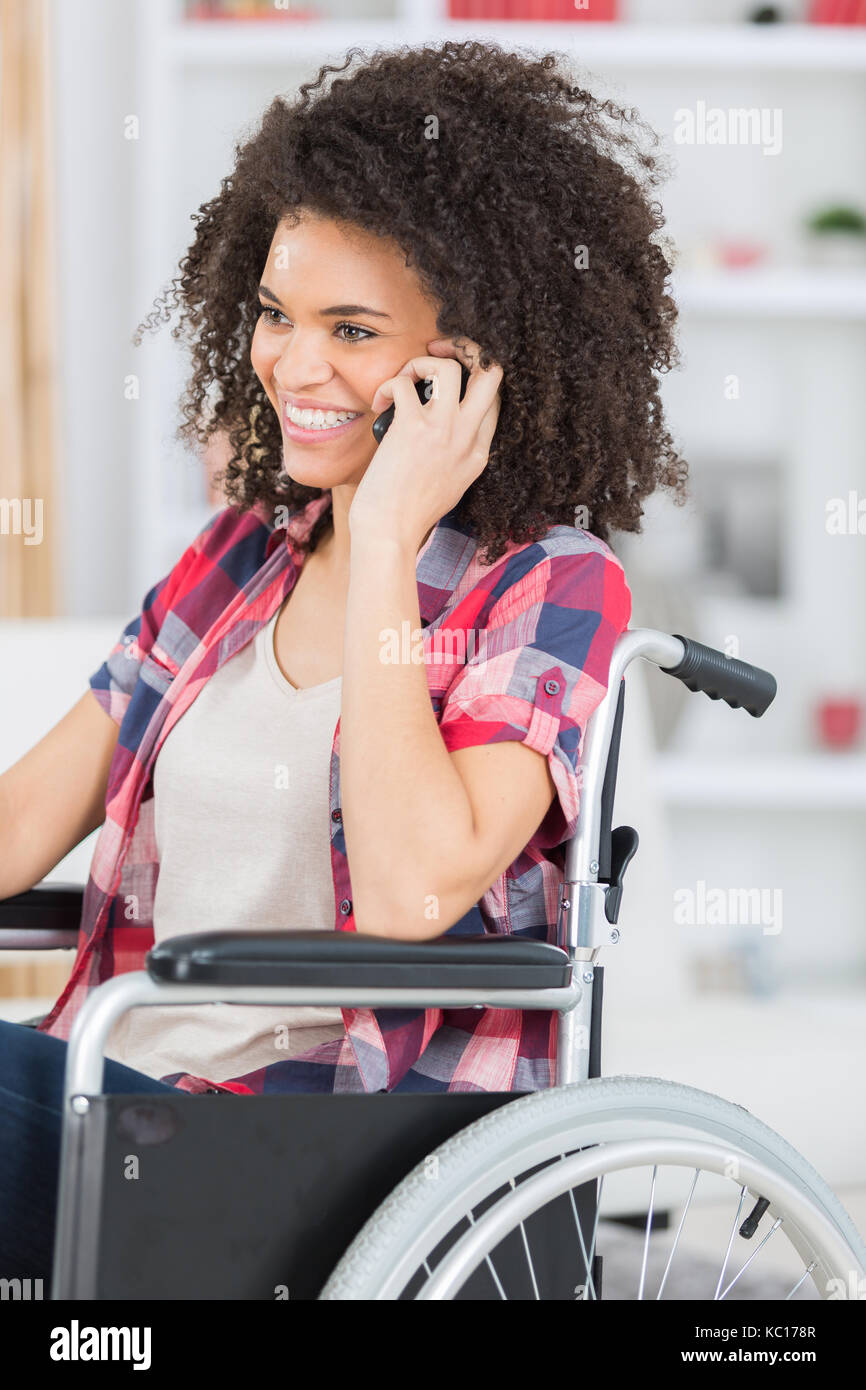 disabled woman on wheelchair using a mobil phone Stock Photo - Alamy