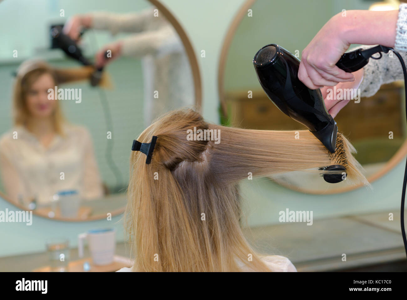 Attractive man drying hair hi-res stock photography and images - Alamy