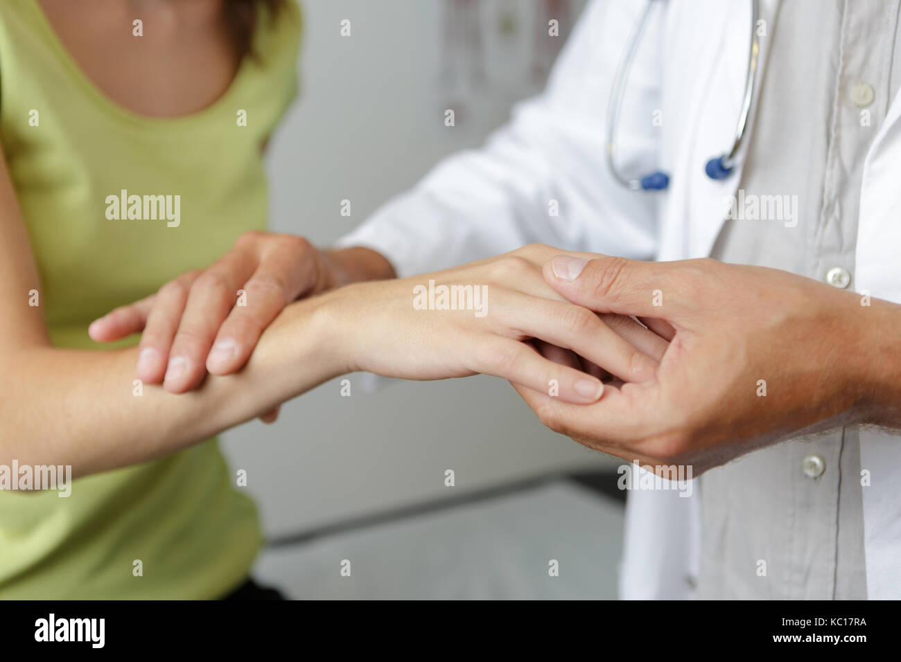 doctors hand checking female patient finger Stock Photo Alamy