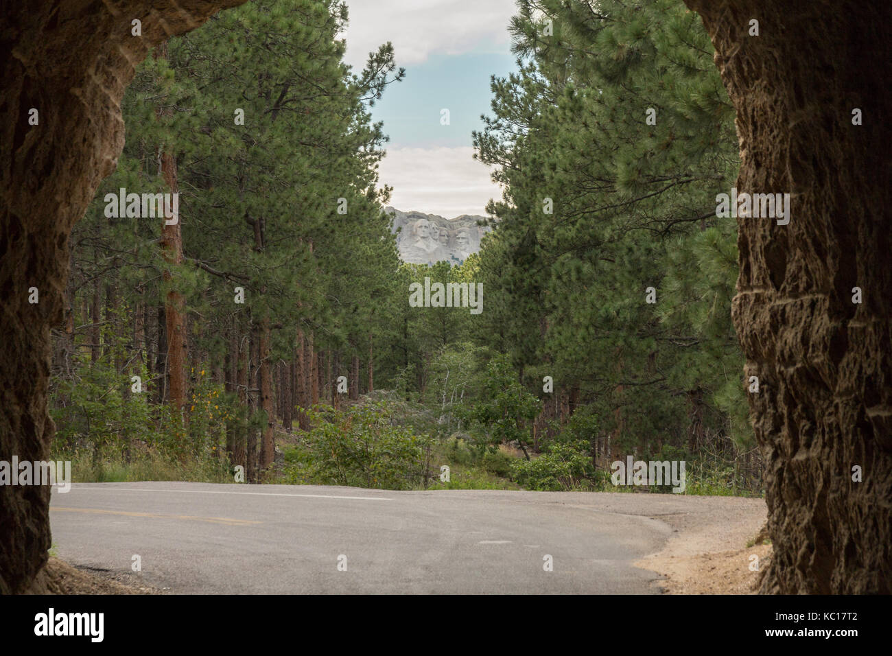 View of the Mount Rushmore National Monument as seen through the Needles Eye Tunnel in Custer State Park, South Dakota, USA. Stock Photo