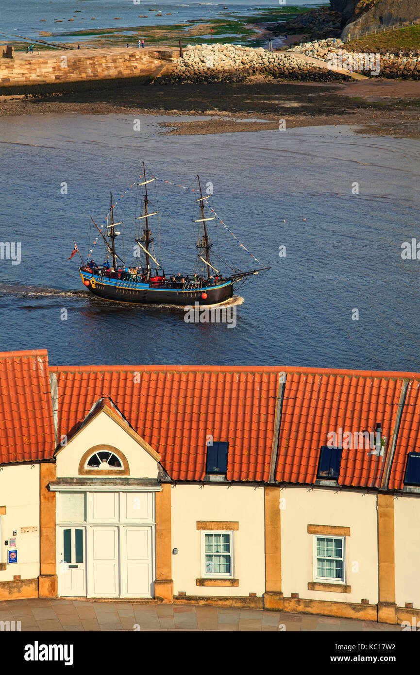 The 'Bark Endeavour', a replica sailing ship, part of the Captain Cook Experience and the Old Boatman's Shelter Apartments, Whitby, Yorkshire, UK Stock Photo