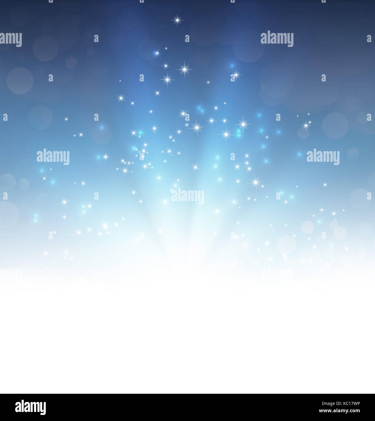 Light explosion and glittering stars on a festive blue background Stock Photo
