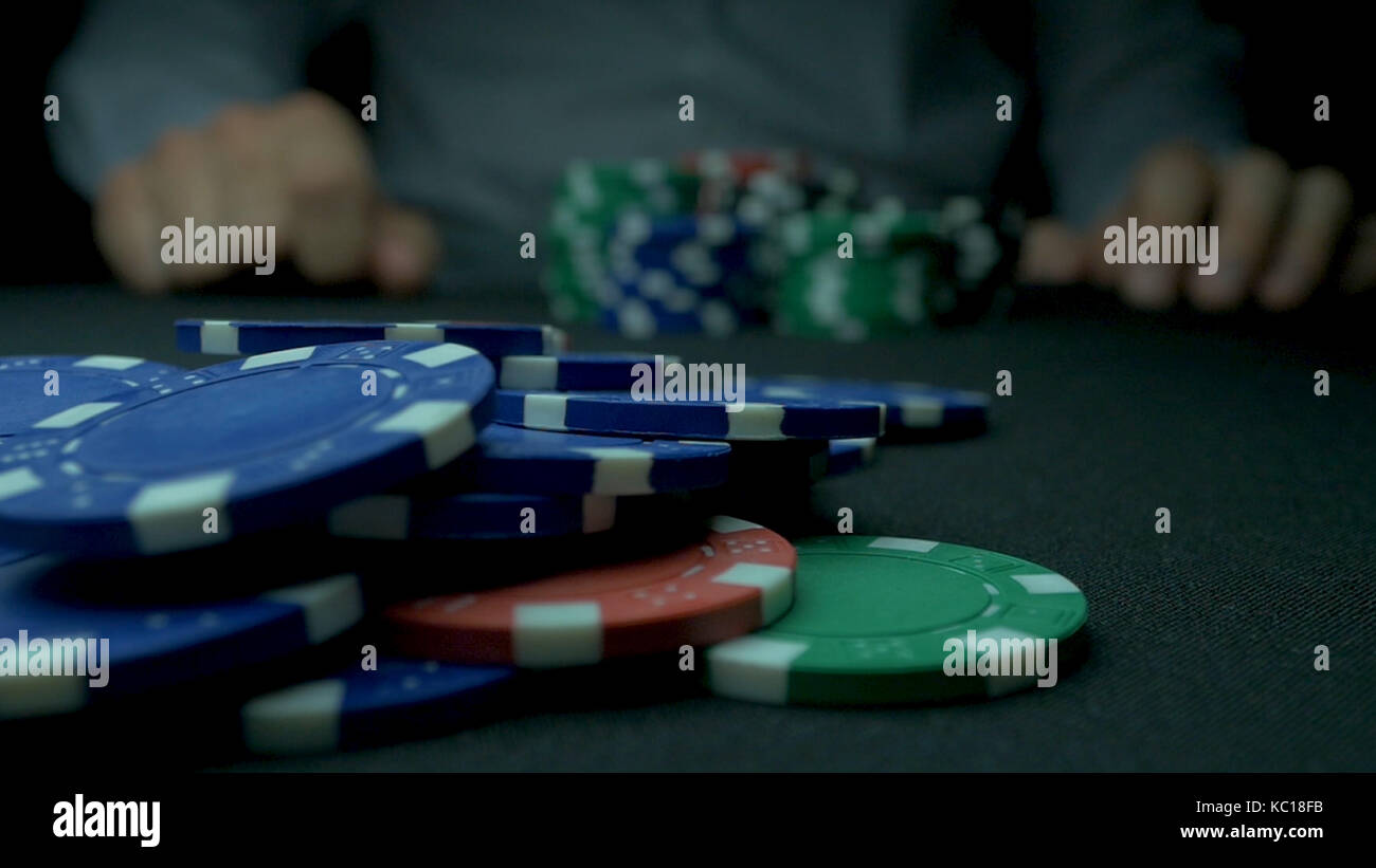 CloseUp of Man Throwing a Poker Chips in slow motion. Closeup of hand
