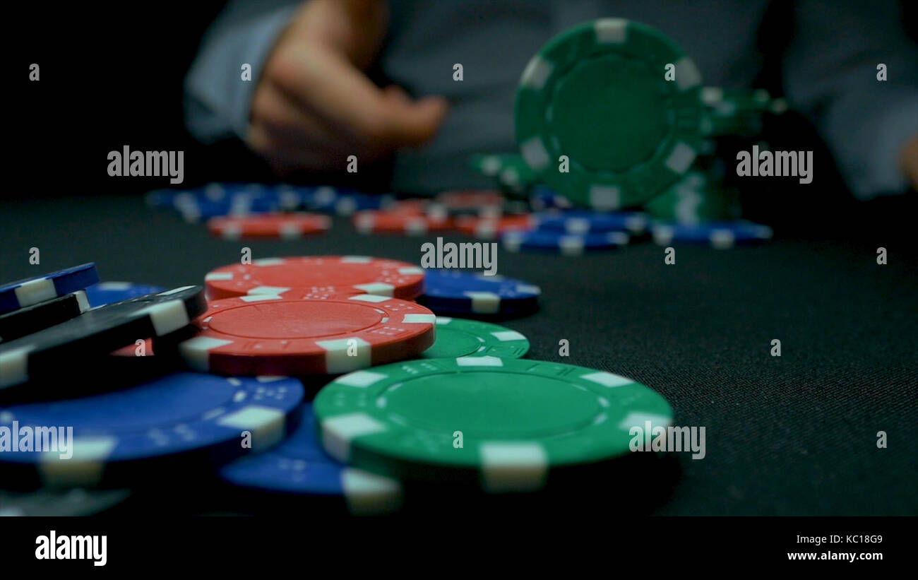 Throw the blue chips in poker. Blue and Red Playing Poker Chips in
