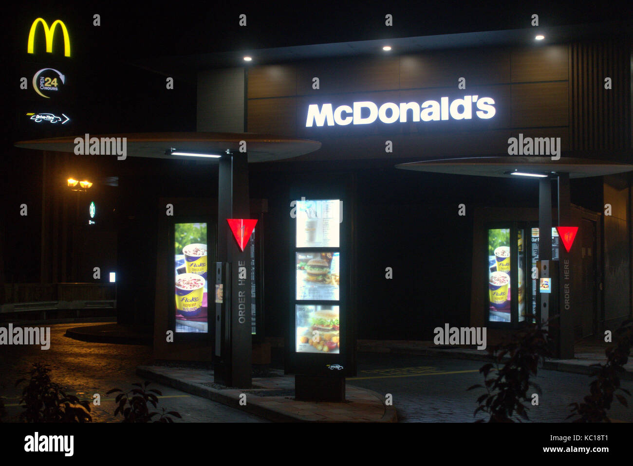 MacDonald's drive in forecourt nighttime after dark Stock Photo