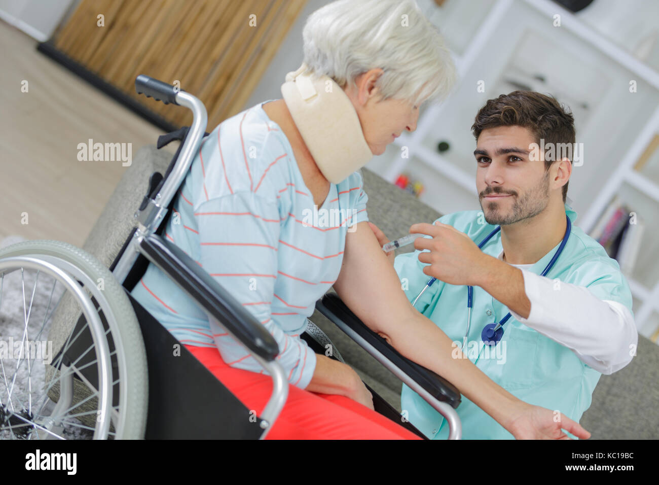 carer supporting old woman with health afflictions Stock Photo