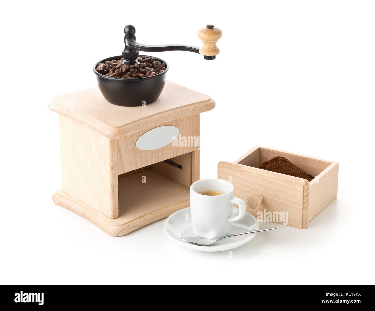 Coffee grinder with ground coffee, coffee beans and cup of espresso on