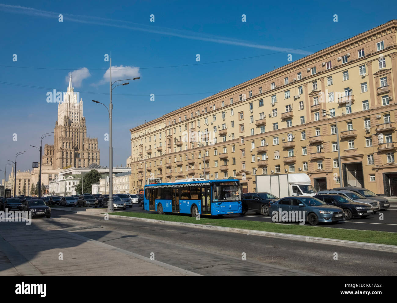 Moscow street scene with apartment block and traffic, and Ministry of Foreign Affairs of Russia main building, Smolenskaya-Sennaya pl, Moscow, Russia Stock Photo