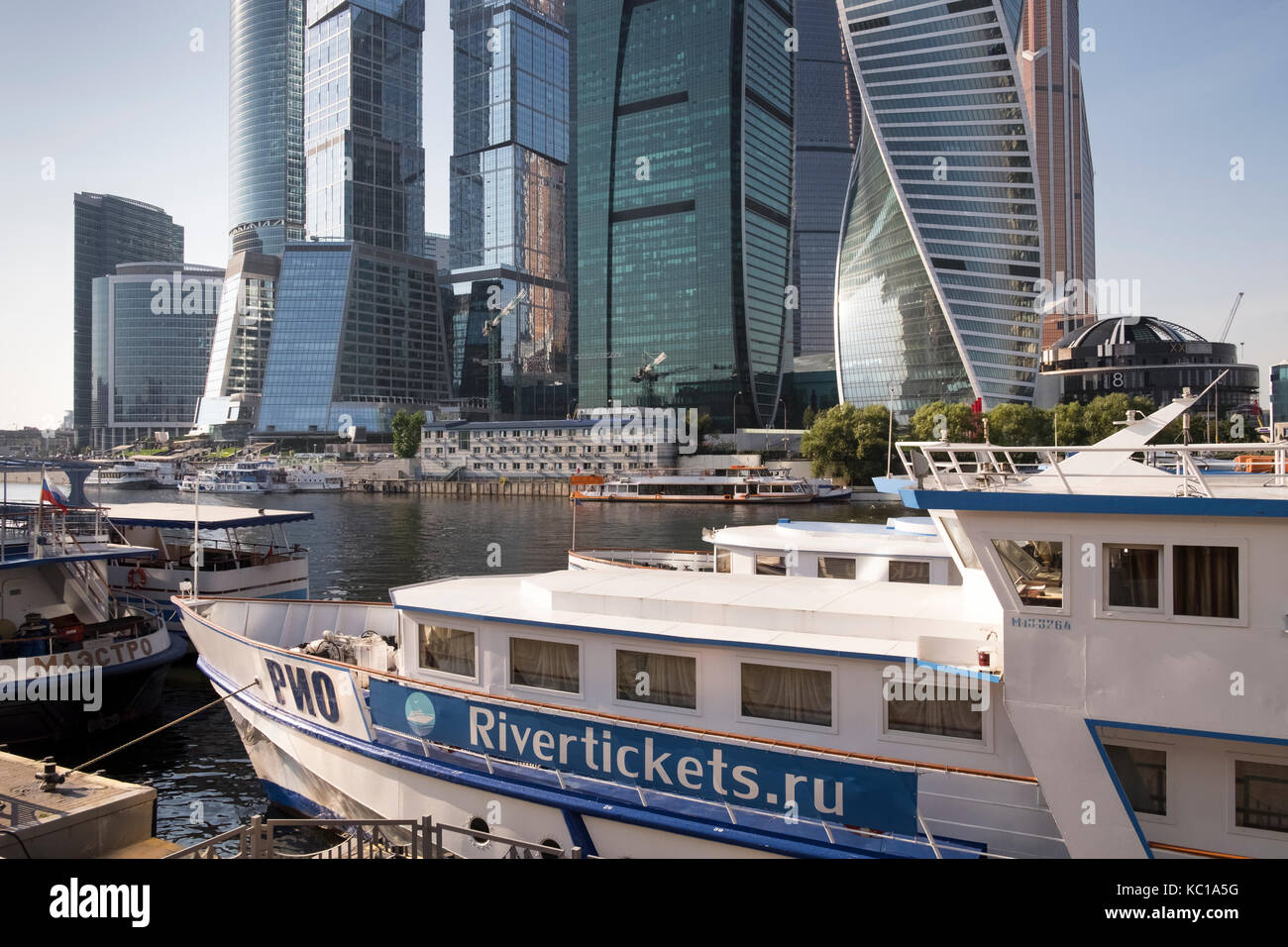 Riverboat moored at high rise skyscrapers of Moscow International Business Centre, aka Moscow City, Presnensky District, Mocow, Russia. Stock Photo